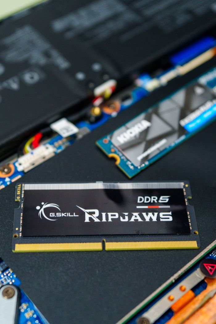 Mastering the First Impression: Your intriguing post title goes here Detailed photo of a G.SKILL Ripjaws DDR5 RAM stick on a computer motherboard, showcasing modern technology.