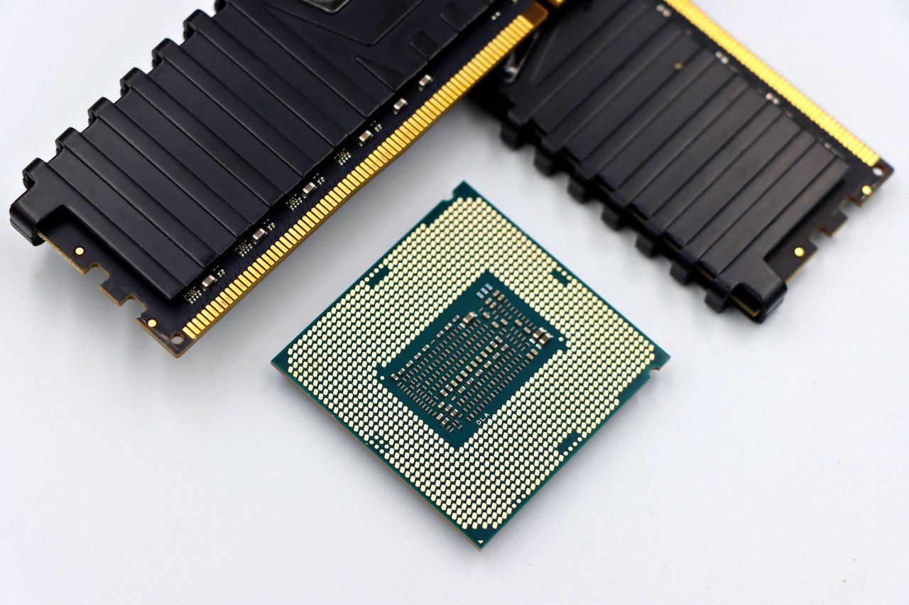 Crafting Captivating Headlines: Your awesome post title goes here A CPU and RAM sticks displayed on a white surface, showcasing computer hardware components.
